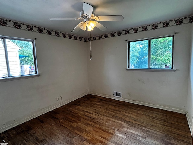 3109 Yale St, Flint, MI 48503 - spare room with healthy amount of natural light, wood finished floors, and a ceiling fan