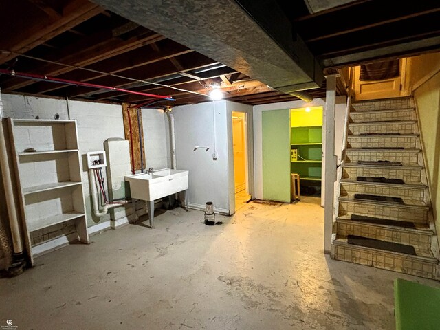 3109 Yale St, Flint, MI 48503 - unfinished below grade area featuring a sink and stairway