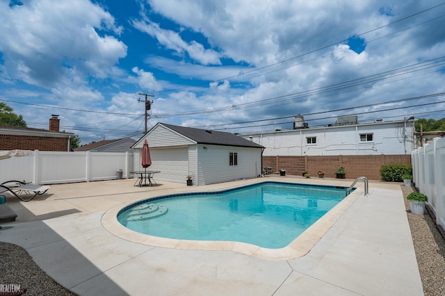 24955 Mabray Ave, Eastpointe, MI 48021 - view of swimming pool featuring a fenced backyard, a patio, and an outdoor structure