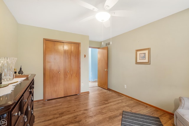 52225 Bryan Michael Dr, Macomb, MI 48042 - bedroom featuring light wood-style floors, a closet, and a ceiling fan