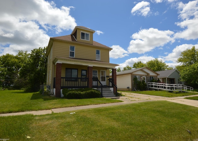 17530 Oakdale St, Roseville, MI 48066 - american foursquare style home featuring covered porch, a front lawn, and brick siding