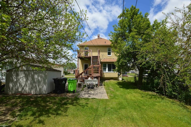 17530 Oakdale St, Roseville, MI 48066 - back of house with stairs, a storage unit, a yard, and a patio area
