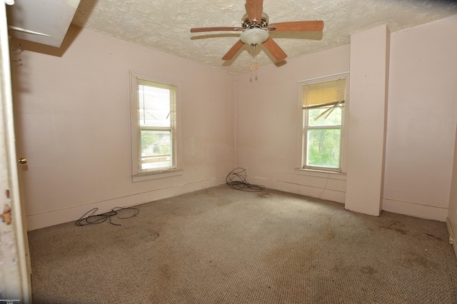 17530 Oakdale St, Roseville, MI 48066 - unfurnished room featuring healthy amount of natural light, carpet floors, a textured ceiling, and a ceiling fan