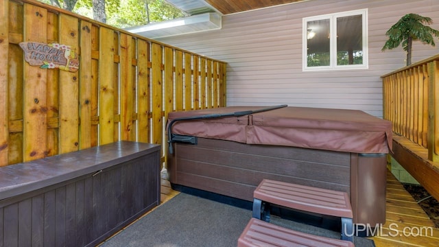 533 25th St, Gladstone, MI 49837 - view of patio / terrace featuring a hot tub