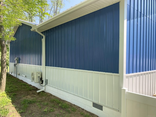 1335 28th St, Manistee, MI 49660 - view of home's exterior with crawl space and an ac unit