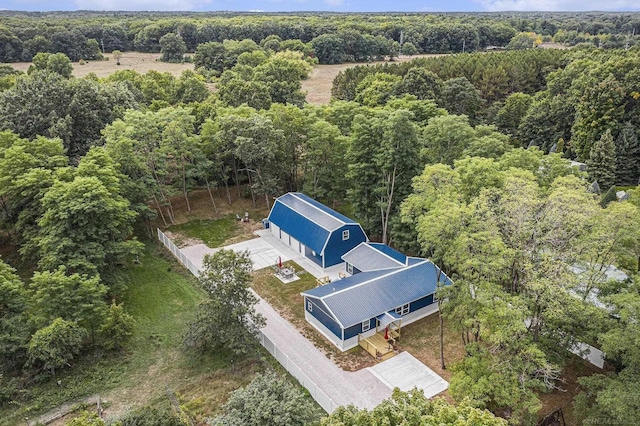 1335 28th St, Manistee, MI 49660 - aerial view of property and surrounding area featuring a heavily wooded area