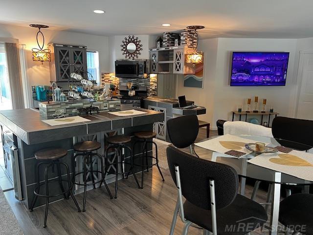 1335 28th St, Manistee, MI 49660 - dining area featuring wood finished floors and recessed lighting