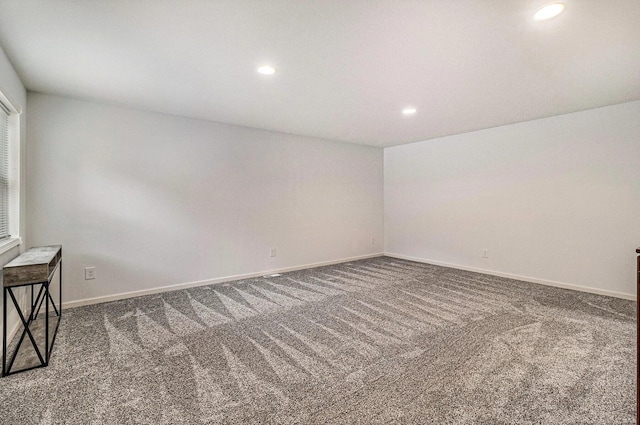 1335 28th St, Manistee, MI 49660 - carpeted empty room with recessed lighting and baseboards