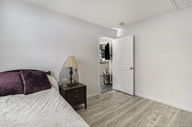 1335 28th St, Manistee, MI 49660 - bedroom featuring wood finished floors and baseboards