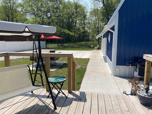 1335 28th St, Manistee, MI 49660 - wooden terrace with a yard and a grill