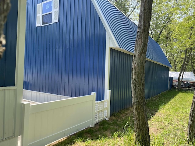 1335 28th St, Manistee, MI 49660 - view of home's exterior with a metal roof