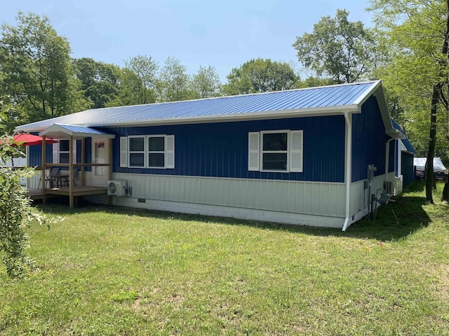 1335 28th St, Manistee, MI 49660 - view of front of home with crawl space, a front yard, and a metal roof