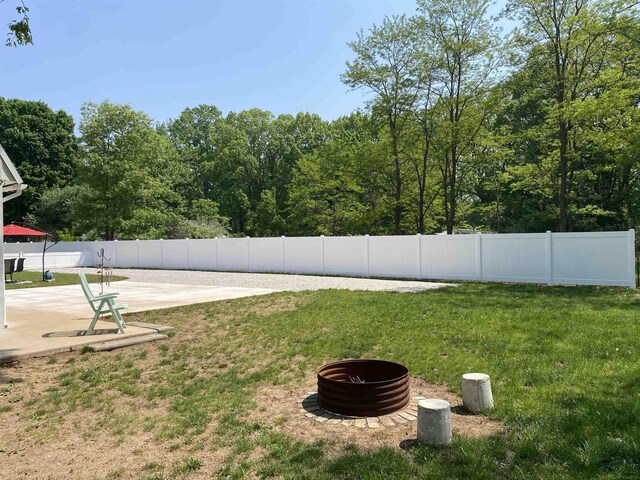 1335 28th St, Manistee, MI 49660 - fenced backyard with a patio area
