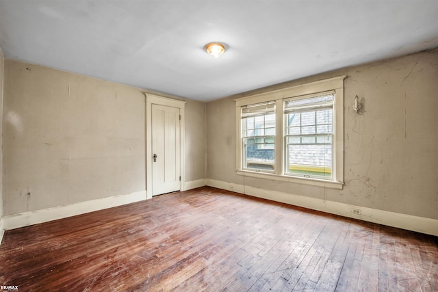 1200 Wells St, Ann Arbor, MI 48104 - empty room with wood-type flooring and baseboards