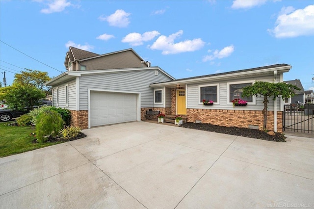 37738 Maplehill St, Harrison Twp, MI 48045 - view of front of house featuring brick siding, driveway, and a garage