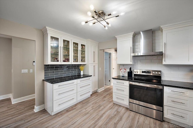 37738 Maplehill St, Harrison Twp, MI 48045 - kitchen featuring wall chimney range hood, stainless steel electric range, a chandelier, backsplash, and light wood-style flooring