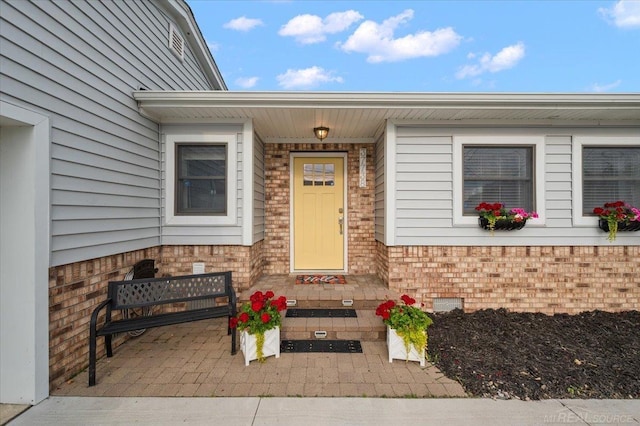 37738 Maplehill St, Harrison Twp, MI 48045 - view of exterior entry featuring brick siding