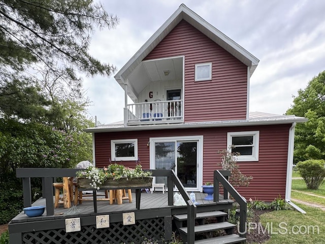 21988 E Everett Ave, Grand Marais, MI 49839 - back of property featuring a balcony and a deck
