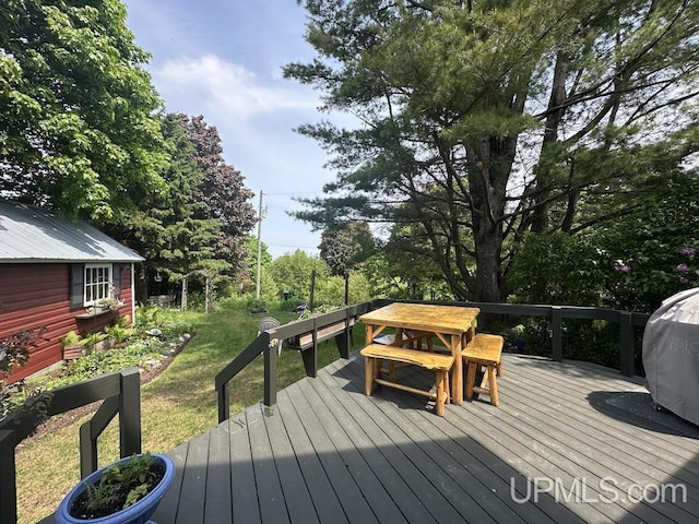 21988 E Everett Ave, Grand Marais, MI 49839 - wooden terrace featuring a yard and outdoor dining area