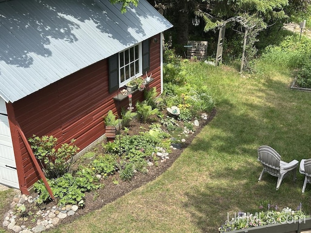 21988 E Everett Ave, Grand Marais, MI 49839 - view of home's exterior featuring a metal roof and a yard