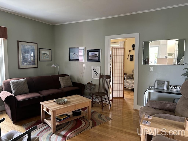 21988 E Everett Ave, Grand Marais, MI 49839 - living room with light wood-style flooring and crown molding
