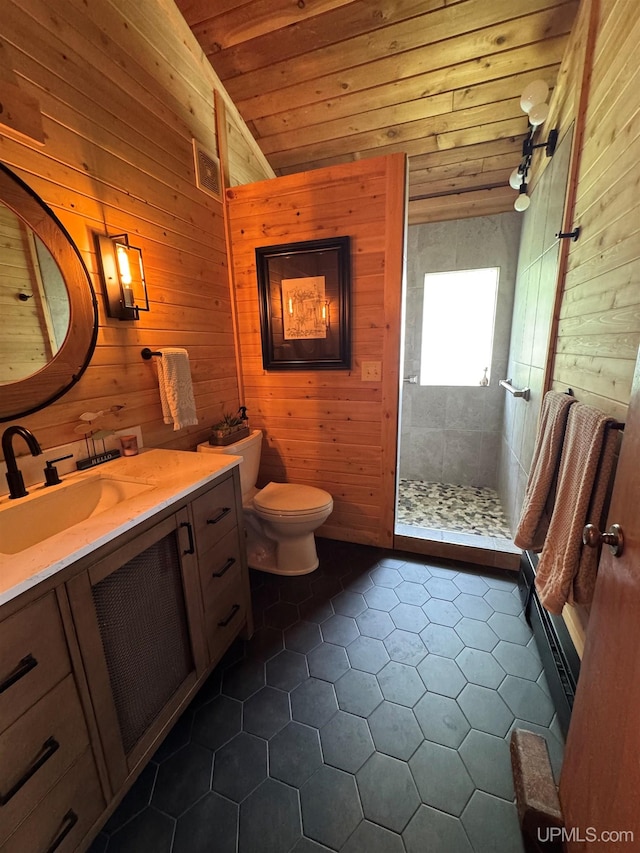 5847 County 513 T Rd, Rapid River, MI 49878 - bathroom featuring wood walls, vanity, tile patterned flooring, a shower stall, and wood ceiling