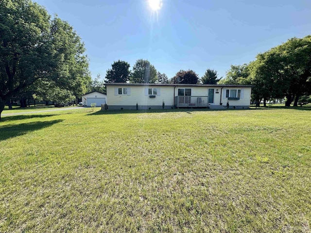 4828 I Rd, Bark River, MI 49807 - rear view of house featuring a detached garage, a lawn, crawl space, and a wooden deck