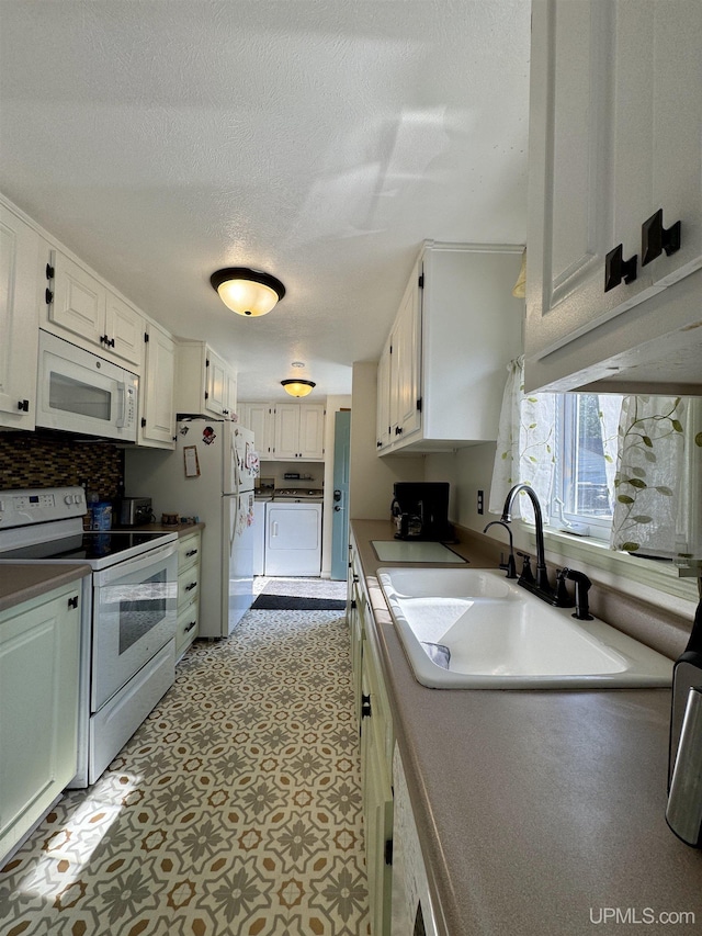 4828 I Rd, Bark River, MI 49807 - kitchen with white appliances, washer and clothes dryer, decorative backsplash, white cabinets, and a textured ceiling