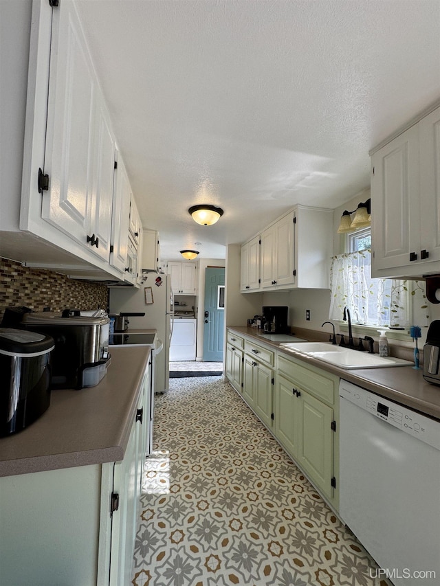 4828 I Rd, Bark River, MI 49807 - kitchen with white appliances, washer / clothes dryer, backsplash, white cabinets, and light flooring