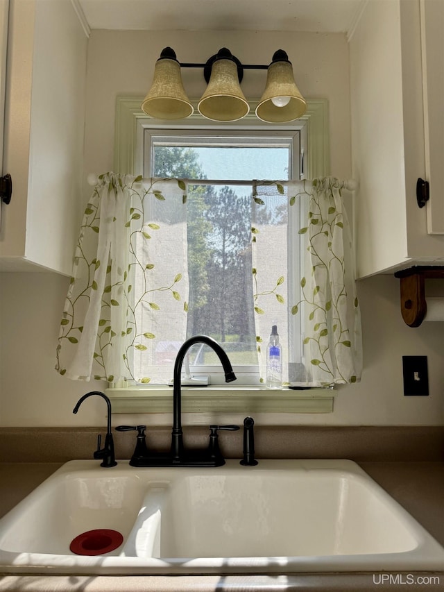 4828 I Rd, Bark River, MI 49807 - detailed view of a sink and white cabinetry