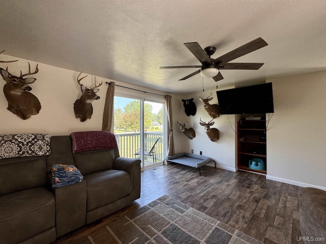 4828 I Rd, Bark River, MI 49807 - living room featuring a ceiling fan, wood finished floors, and a textured ceiling