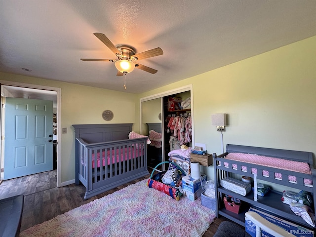 4828 I Rd, Bark River, MI 49807 - bedroom featuring a closet, wood finished floors, and ceiling fan