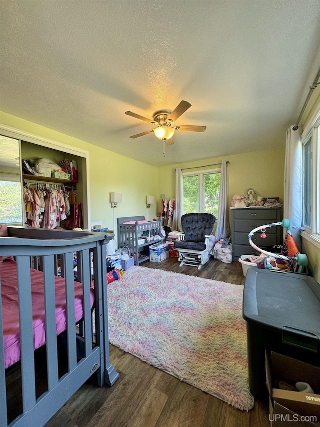 4828 I Rd, Bark River, MI 49807 - living room with wood finished floors, a ceiling fan, and a textured ceiling
