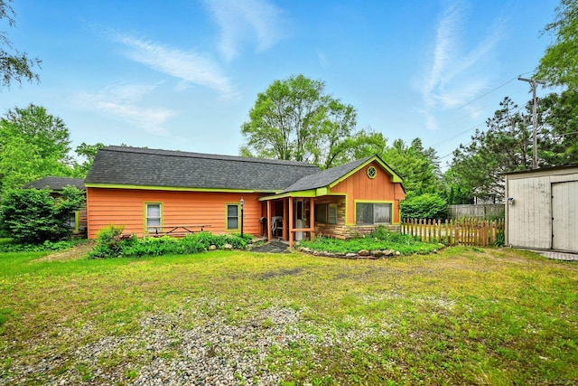 9970 Sedlock Ave, White Lake, MI 48386 - back of property with a storage shed and roof with shingles