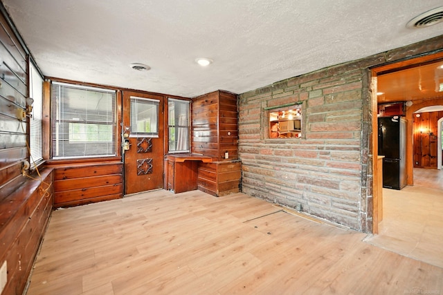 9970 Sedlock Ave, White Lake, MI 48386 - unfurnished sunroom featuring arched walkways