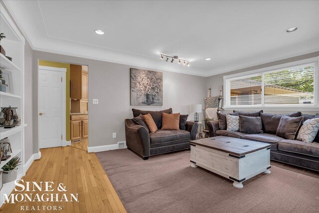 1076 Kelley St, Troy, MI 48083 - living area featuring light wood-style flooring, recessed lighting, and crown molding