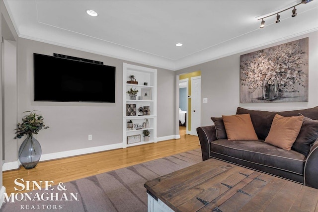 1076 Kelley St, Troy, MI 48083 - living area with built in shelves, wood finished floors, recessed lighting, and ornamental molding