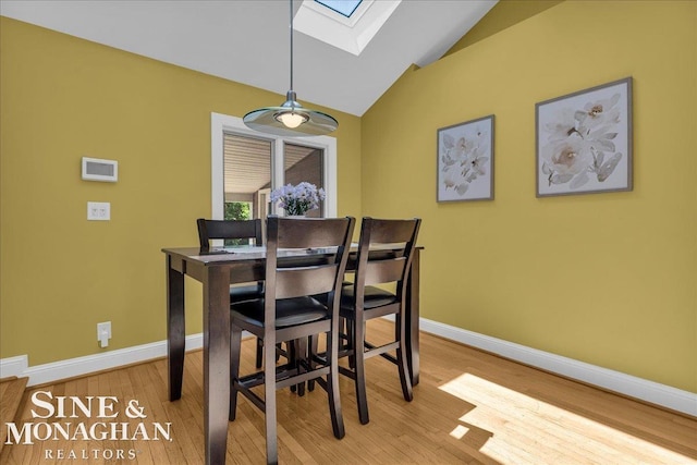 1076 Kelley St, Troy, MI 48083 - dining room with a skylight, wood finished floors, and vaulted ceiling