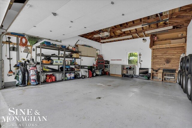 1076 Kelley St, Troy, MI 48083 - garage featuring a garage door opener