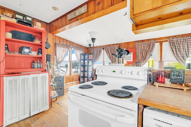 8941 Lakeshore Rd, Lexington, MI 48450 - kitchen featuring white appliances, plenty of natural light, light wood-style floors, and wood walls