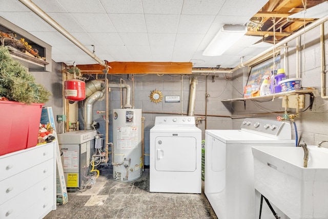 8941 Lakeshore Rd, Lexington, MI 48450 - laundry room featuring gas water heater, washer and clothes dryer, and a heating unit