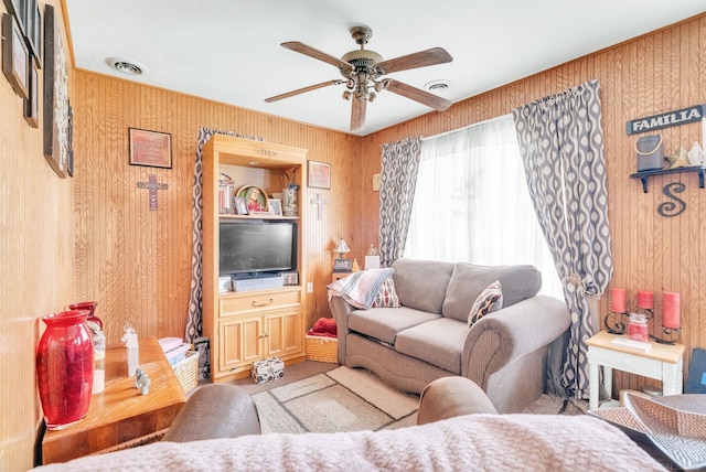 8941 Lakeshore Rd, Lexington, MI 48450 - living room featuring a ceiling fan and wooden walls