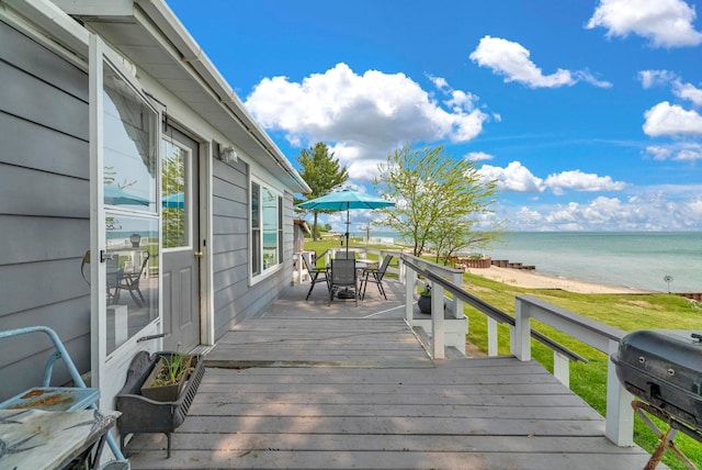 8941 Lakeshore Rd, Lexington, MI 48450 - deck featuring view of water and beach, a grill, and outdoor dining area
