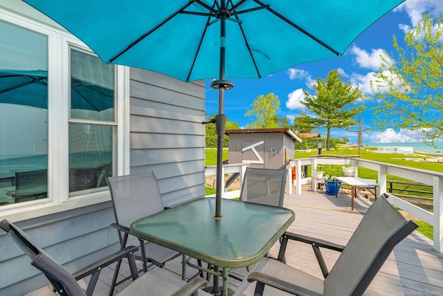 8941 Lakeshore Rd, Lexington, MI 48450 - wooden terrace with outdoor dining space