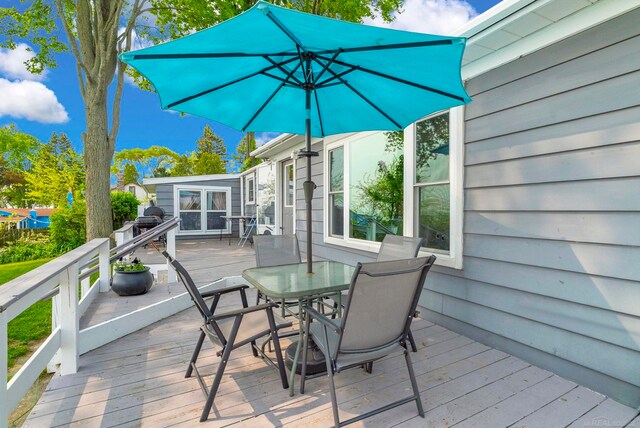 8941 Lakeshore Rd, Lexington, MI 48450 - wooden terrace featuring outdoor dining area
