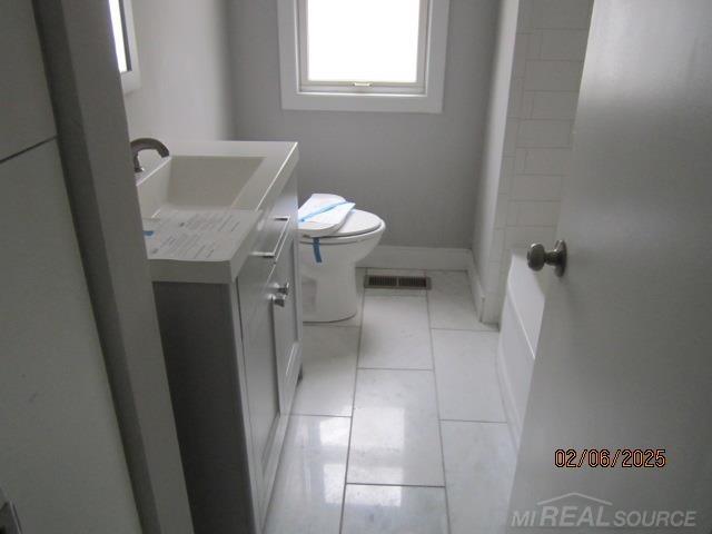 22636 Downing St, Saint Clair Shores, MI 48080 - bathroom featuring vanity and tile patterned floors