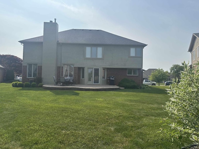 48274 Prestwyck Rd, Macomb, MI 48044 - rear view of property featuring a patio area, brick siding, a lawn, and a chimney