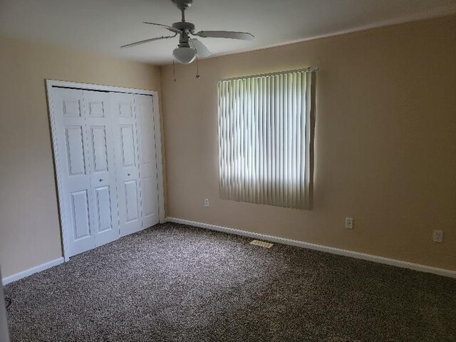 4161 Pine St, Gladwin, MI 48624 - unfurnished bedroom with carpet flooring, a closet, and a ceiling fan