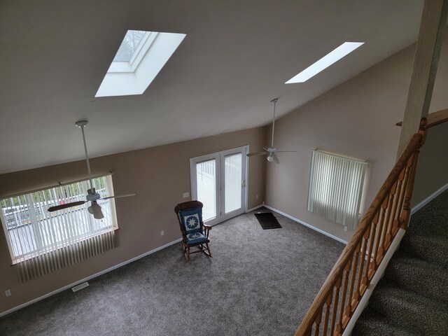 4161 Pine St, Gladwin, MI 48624 - unfurnished room featuring a skylight, carpet, ceiling fan, and lofted ceiling