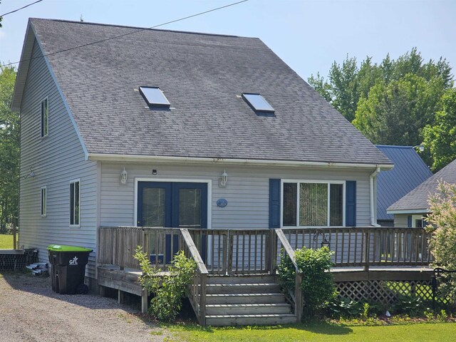 4161 Pine St, Gladwin, MI 48624 - rear view of property with a wooden deck, roof with shingles, and french doors